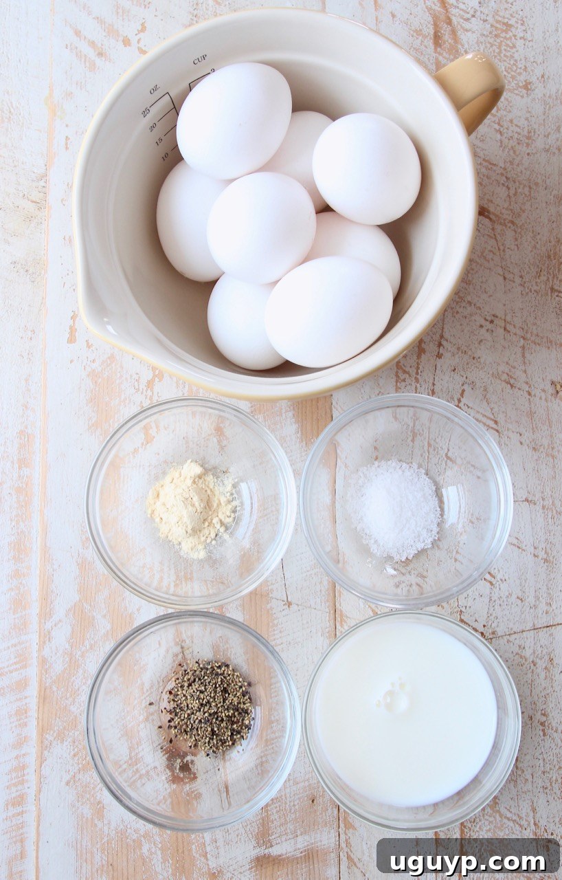 Assortment of fresh ingredients laid out for making egg muffins, including eggs, milk, and various vegetables.