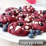 Red Velvet Cookies are filled with white chocolate chips and blueberries in this colorful and patriotic dessert recipe, perfect for summer and 4th of July!