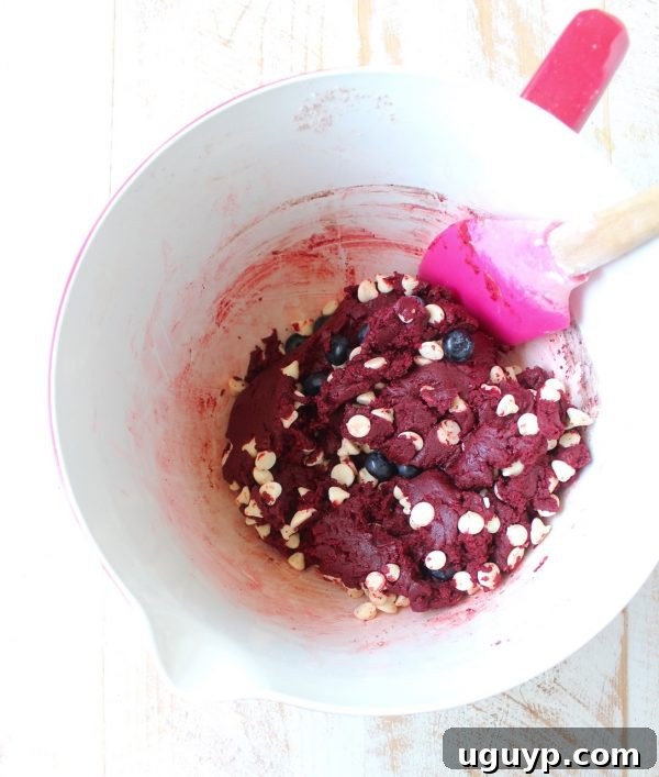 Two steps showing the process of making Red Velvet Cookies: dry ingredients in one bowl, and wet ingredients with vibrant red food coloring in another.
