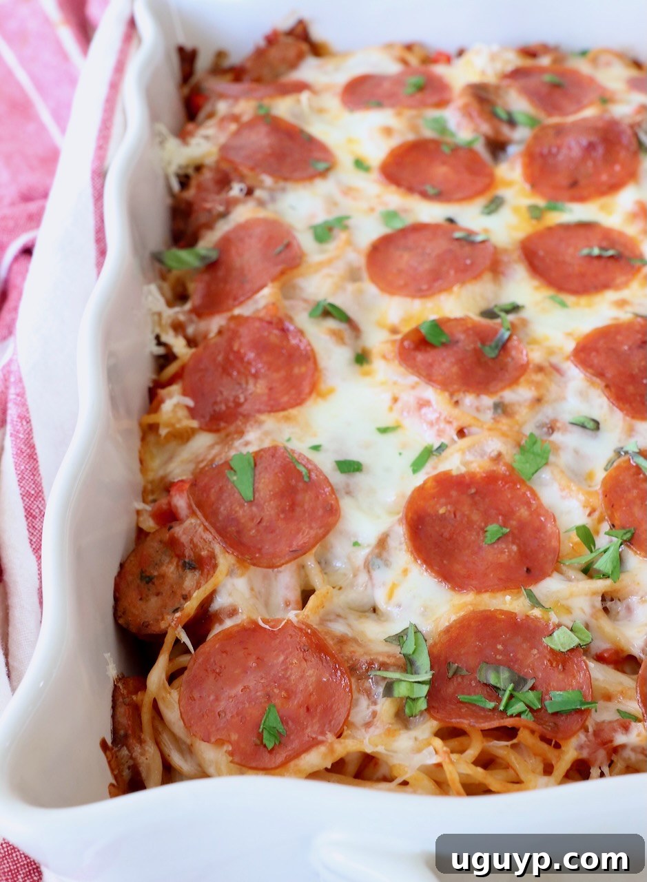 Finished Pizza Baked Spaghetti in a casserole dish, with melted cheese and pepperoni on top.
