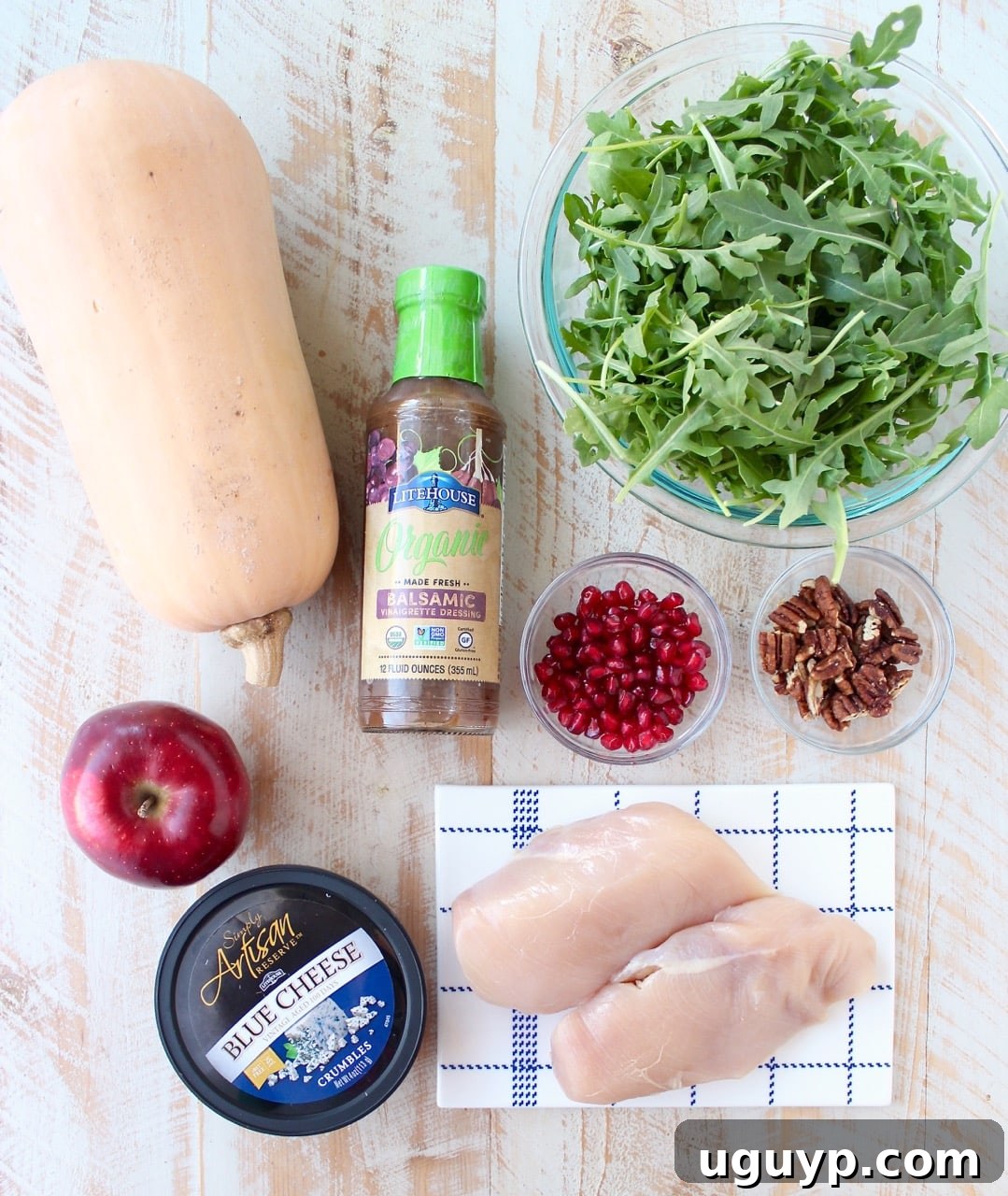 ingredients for balsamic chicken and butternut squash noodles bowls on a white wood board
