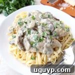 A decadently creamy mushroom sauce covers chicken Parmesan in this quick and easy Mushroom Chicken recipe that you'll want to make over and over!