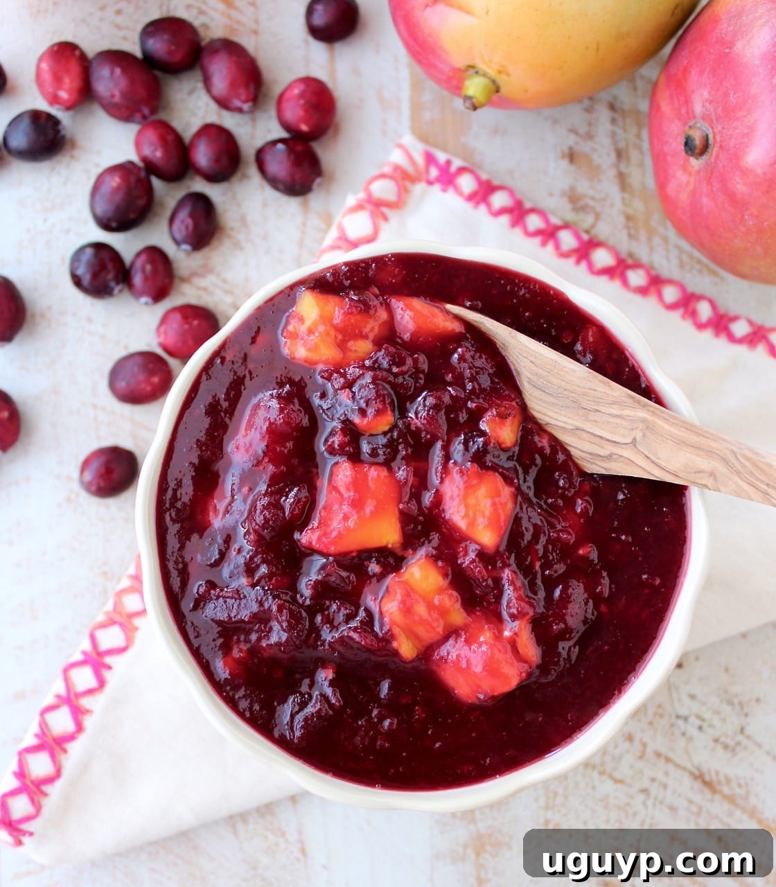 Chipotle peppers & fresh mango add smokey, sweet & tropical flavors to a traditional cranberry sauce, delicious as a ham glaze or perfect served with turkey!