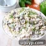 This insanely delicious Mac and Cheese recipe is a seriously scrumptious twist on the Philly Cheesesteak and it's easily made in only 29 minutes!