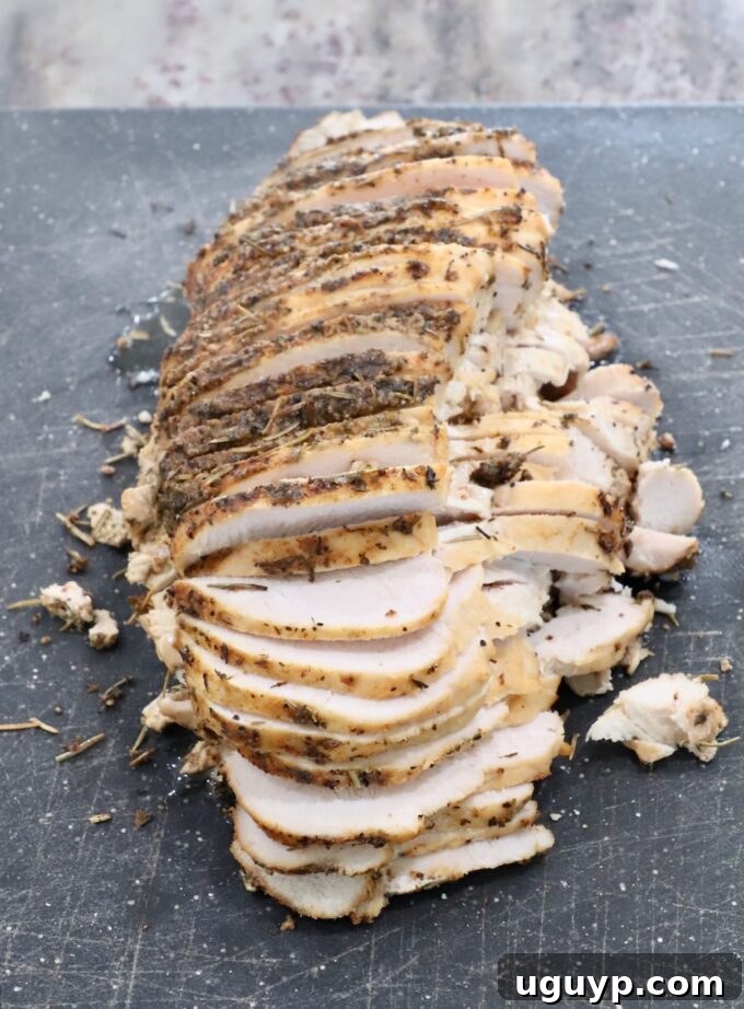 Perfectly sliced turkey breast on a cutting board, ready to serve