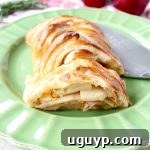 Warm caramelized apples & creamy brie cheese are wrapped up in a puff pastry for an easy & delicious apple strudel recipe, great for breakfast, an appetizer or dessert!