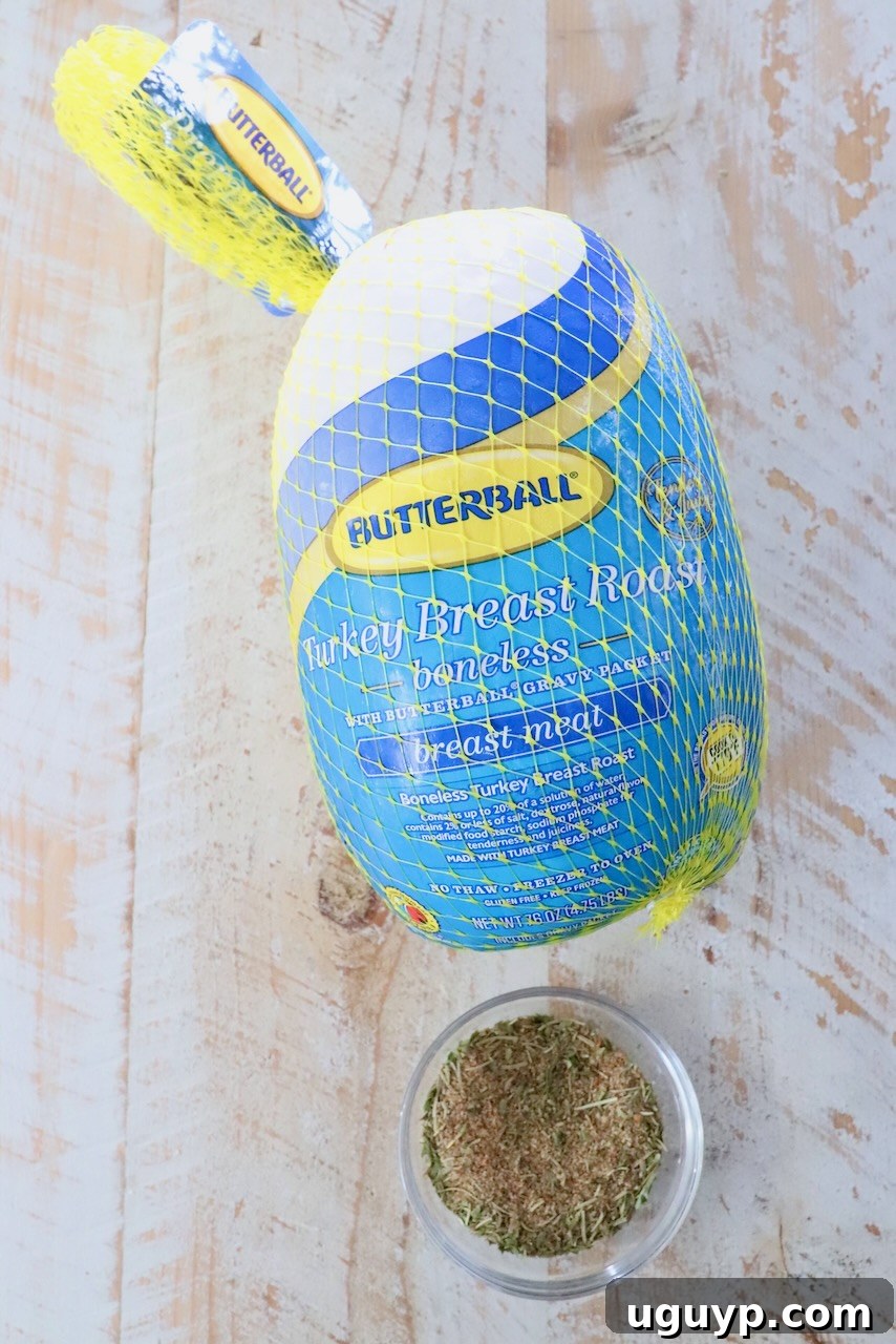 Boneless turkey breast in its packaging next to a bowl of homemade turkey seasoning, ready for preparation.