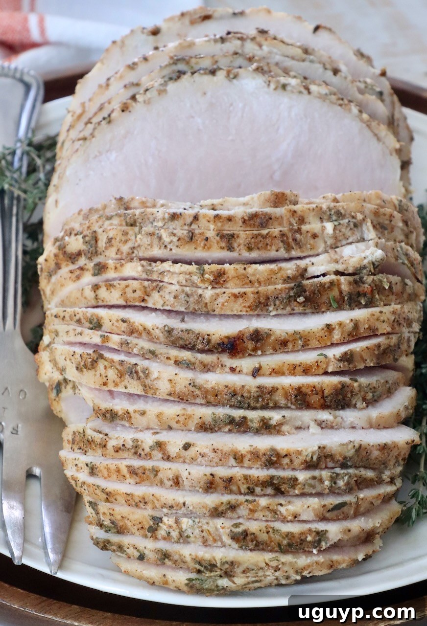Sliced sous vide turkey breast plated beautifully, ready to be served.