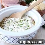 The ultimate game day party dip, this Ham and Cheese Jalapeno Popper Dip is so easy to make in the slow cooker and will be a hit with all of your friends!