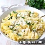 Baked spaghetti squash is tossed with a simple spinach artichoke sauce in this healthy, gluten free and vegetarian recipe, made in under an hour!