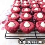 Red velvet cookie cups filled with cream cheese frosting are a delicious and adorable dessert recipe that's also easy to make! Perfect for Valentine's Day, birthdays or any day you're craving a sweet treat!