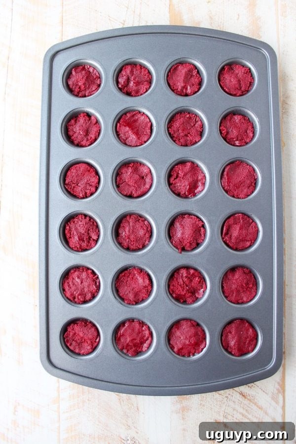 Red velvet cookie cups filled with cream cheese frosting are a delicious and adorable dessert recipe that's also easy to make! Perfect for Valentine's Day, birthdays or any day you're craving a sweet treat!