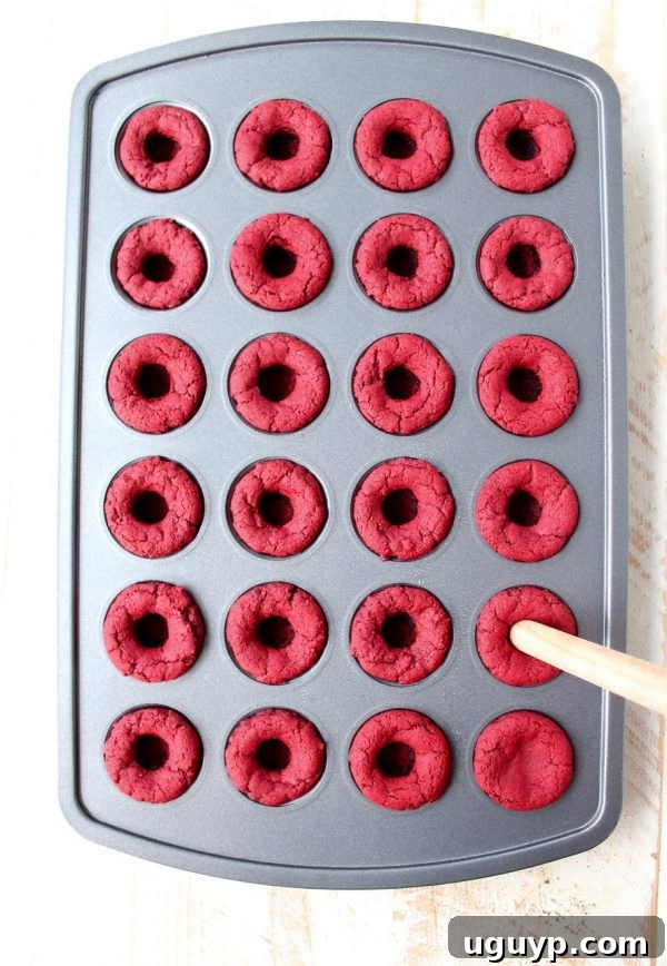 Red velvet cookie cups filled with cream cheese frosting are a delicious and adorable dessert recipe that's also easy to make! Perfect for Valentine's Day, birthdays or any day you're craving a sweet treat!
