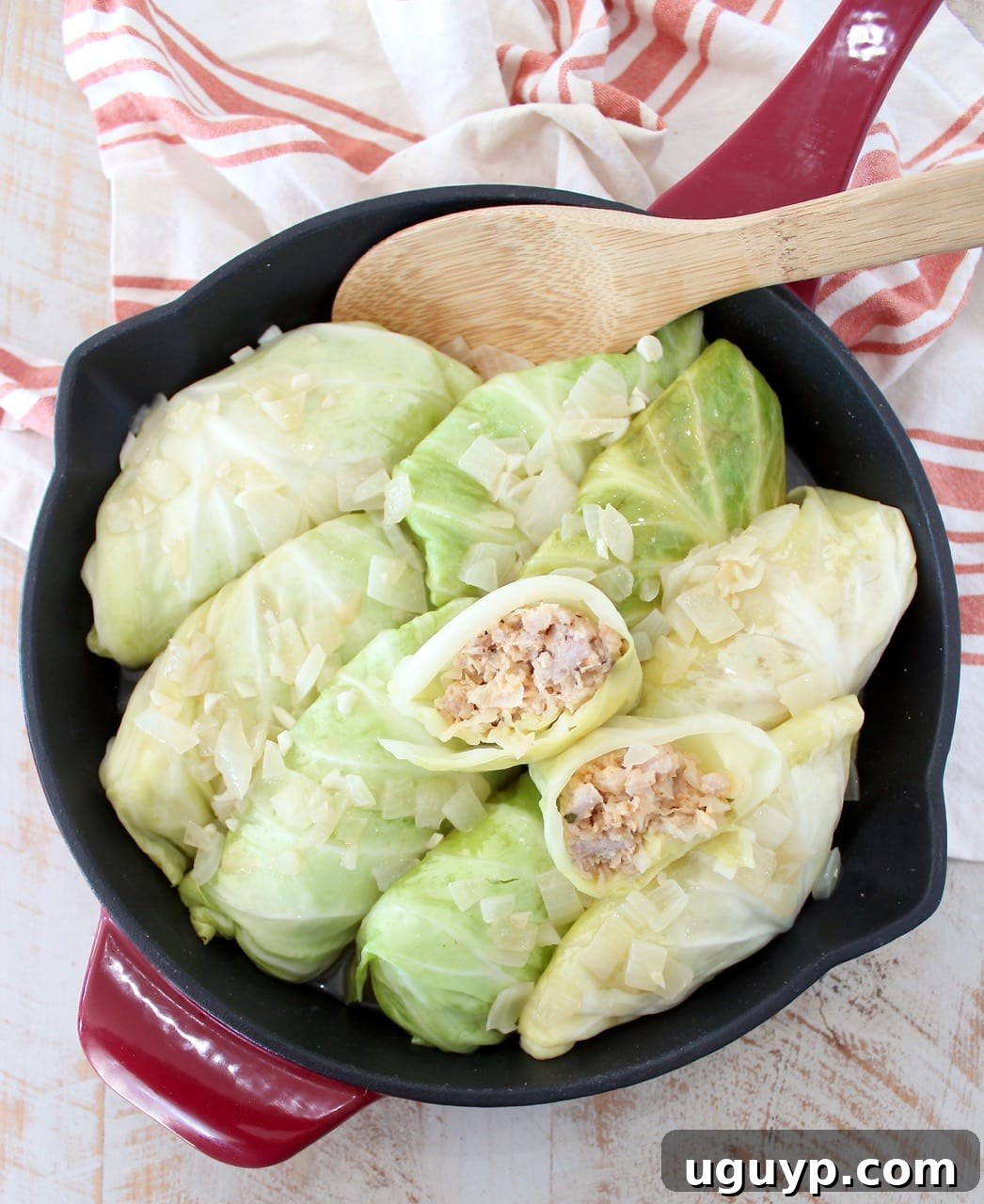 Hearty German Cabbage Rolls simmering in a skillet, ready to be served.