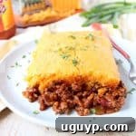 Traditional cornbread chili pie is kicked up a notch in this downright delicious version made with buffalo sauce and cheddar cheese!