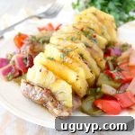 A small image of Whole30 Pineapple Teriyaki Pork Tenderloin, highlighting the golden-brown pork and vibrant pineapple.