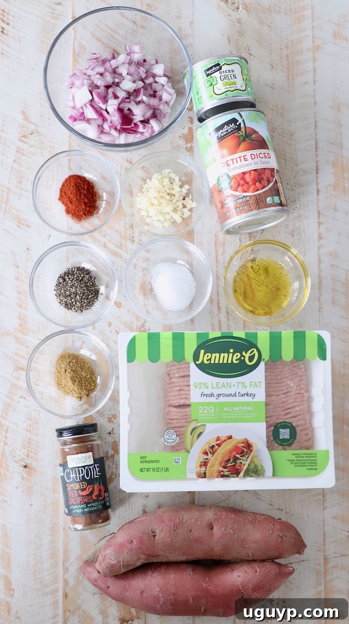 ingredients for chili stuffed sweet potatoes on white wood board