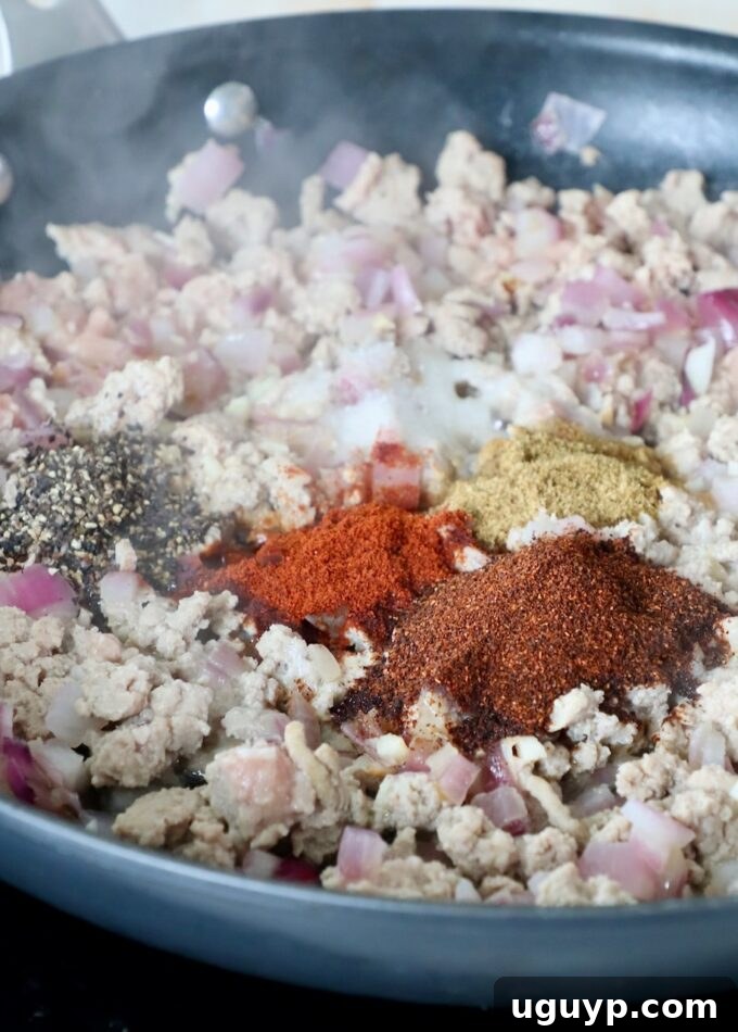 cooked ground turkey in skillet with spices