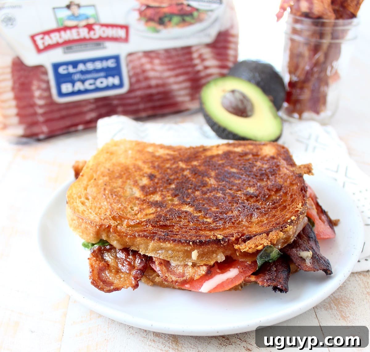Crispy bacon, creamy avocado and juicy tomatoes are combined in this scrumptious gruyere and avocado grilled cheese sandwich recipe!