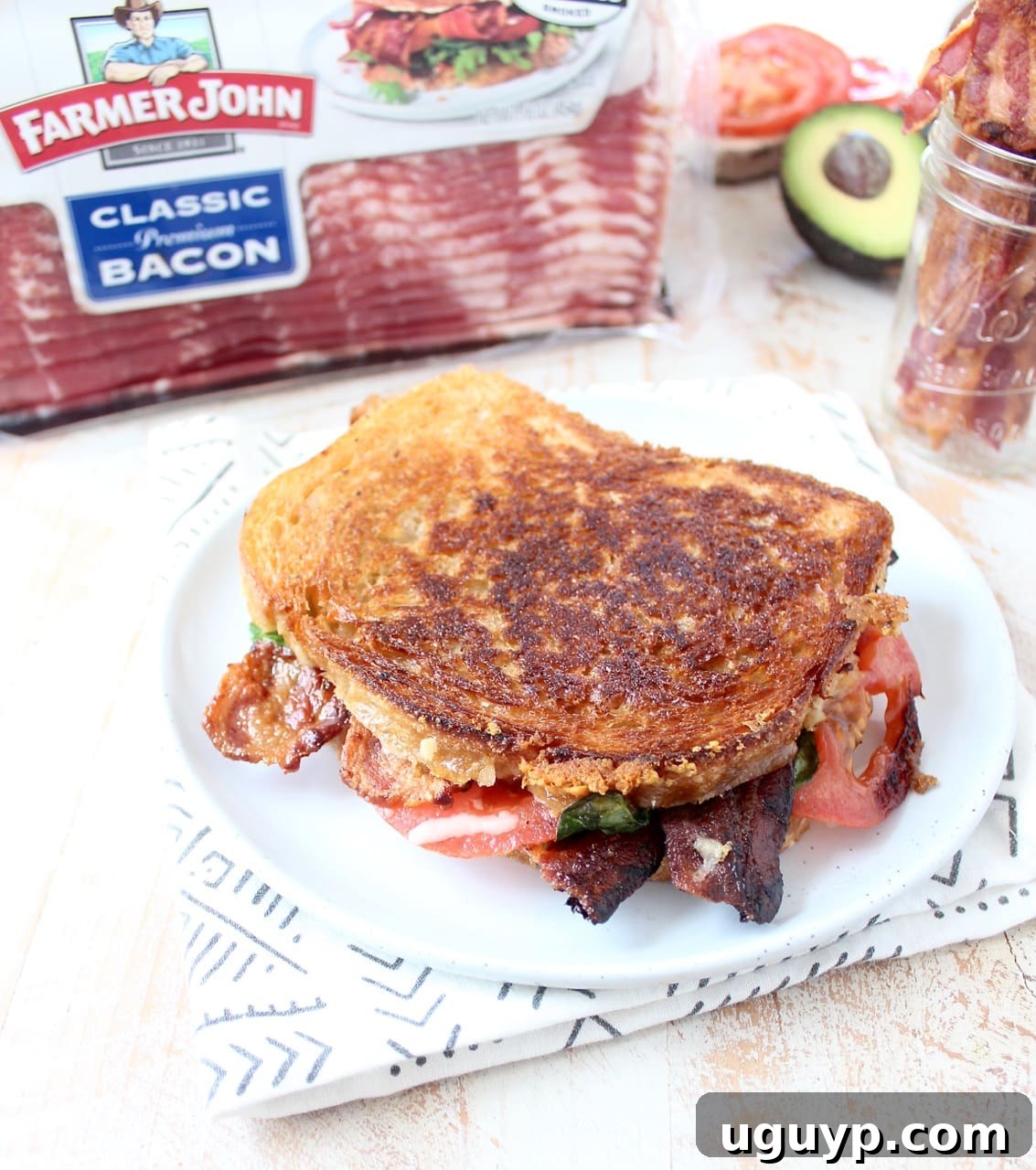 Crispy bacon, creamy avocado and juicy tomatoes are combined in this scrumptious gruyere and avocado grilled cheese sandwich recipe!