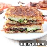 Crispy bacon, creamy avocado and juicy tomatoes are combined in this scrumptious gruyere and avocado grilled cheese sandwich recipe!