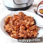 Instant Pot BBQ Chicken is easy to make with chicken breasts, directly from the freezer or refrigerator, plus a bottle of your favorite BBQ sauce. Use it to make different recipes throughout the week, from pasta for dinner, to wraps for lunch!
