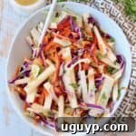 jicama slaw in bowl with spoon