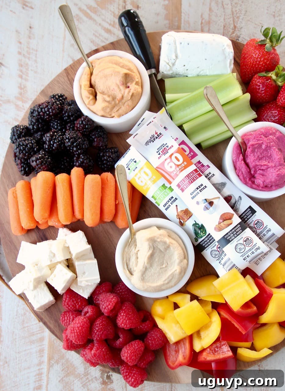 Low Calorie Gluten Free Charcuterie Board with Berries, Celery, Carrots, Bell Peppers, Hummus and Cheese