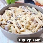 French Onion Chicken Penne Pasta in Skillet with Green Bell Peppers