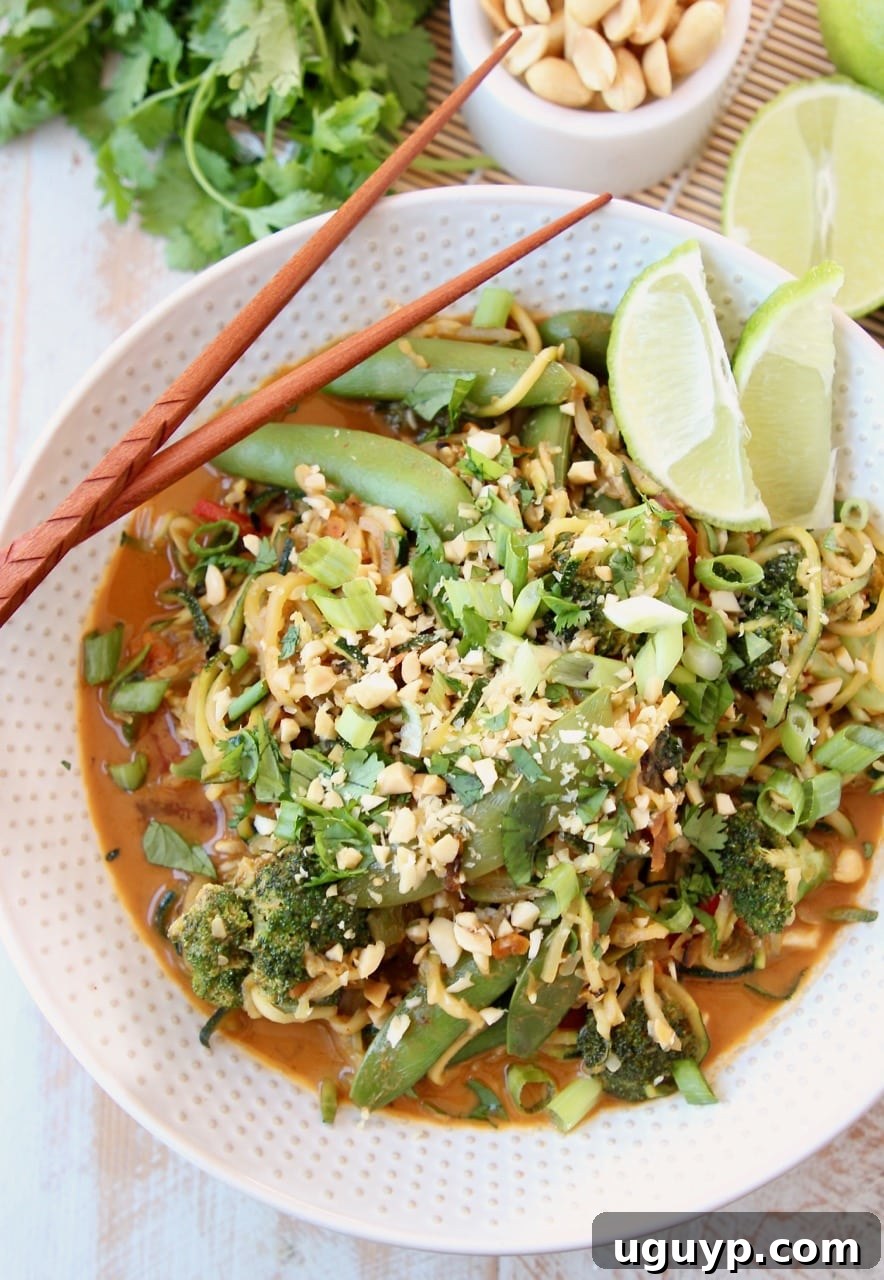 Vegan Pad Thai Recipe with Fresh Scallions, Limes, Broccoli and Cilantro in bowl with chopsticks