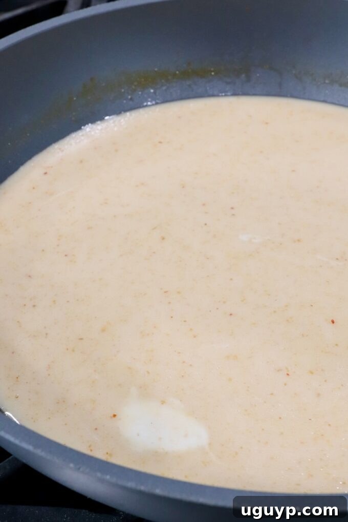 coconut milk and broth in a large pot