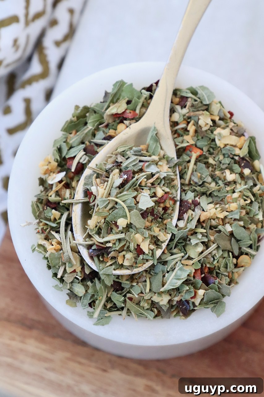 Italian seasoning in a bowl with a spoon