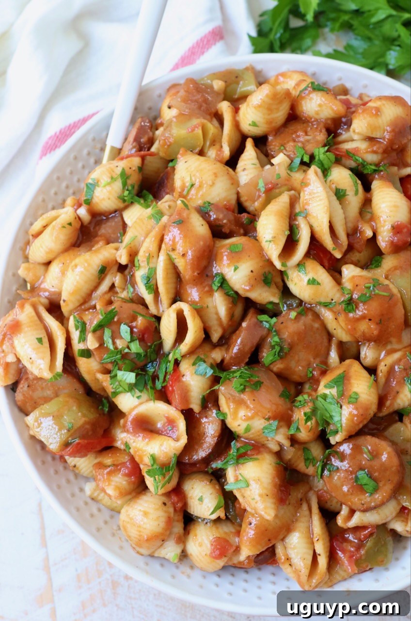 cajun pasta with sauce in a large bowl with a fork