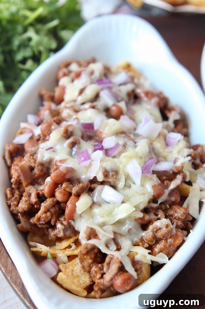 frito chili pie in white baking dish