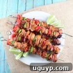 Chipotle Lime Grilled Chicken Skewers, close up on a white plate.