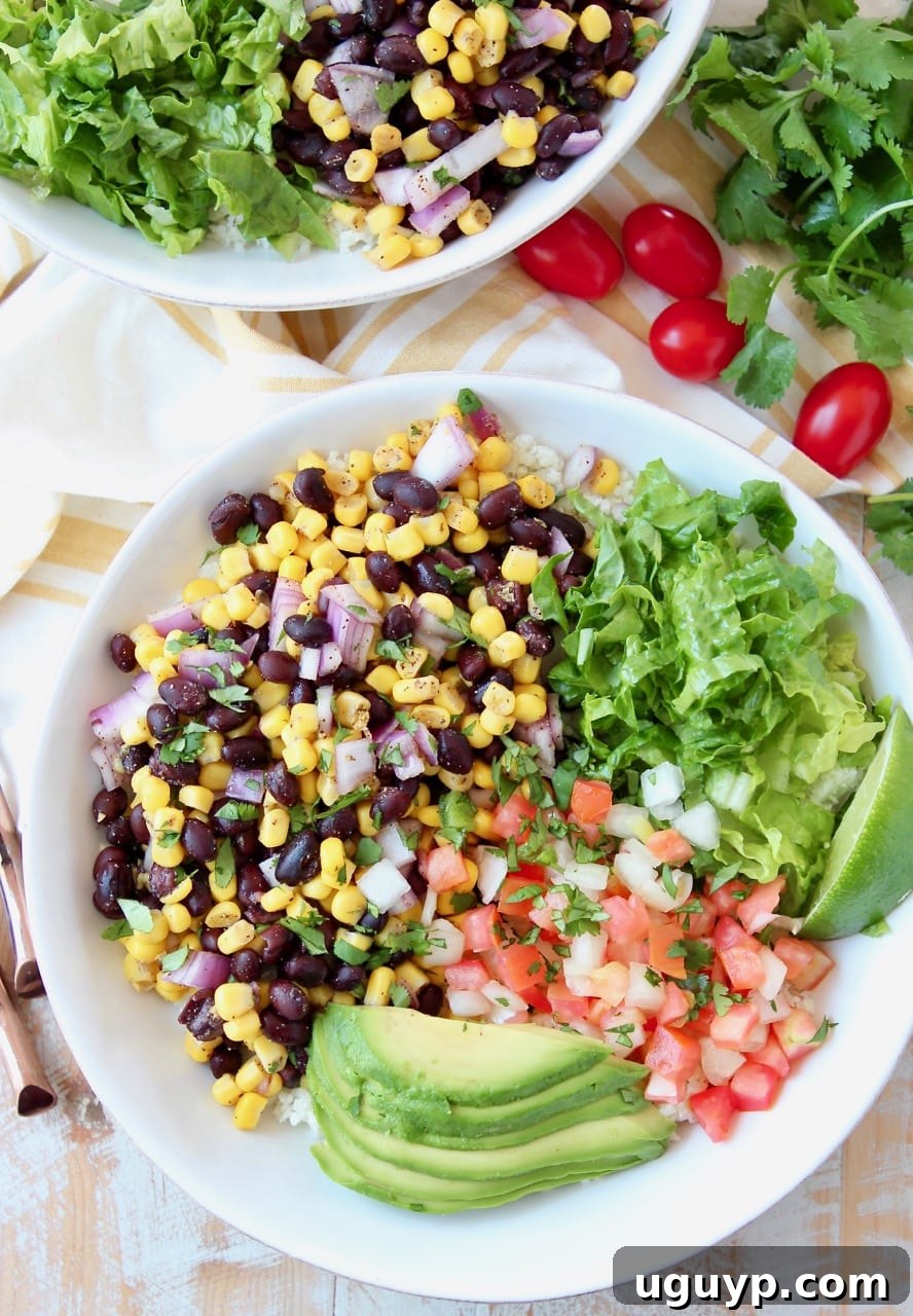 Burrito bowl filled with corn and black bean relish, pico de gallo, avocado and shredded lettuce