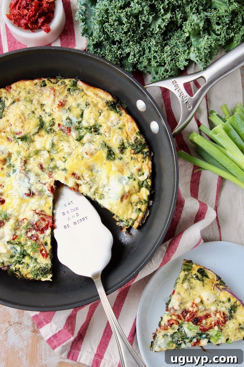 A perfectly cooked vegetable frittata sits in a skillet, with a slice removed and placed on a white plate beside it, garnished with fresh herbs.
