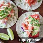 Overhead image of lobster tacos topped with remoulade sauce and cilantro garnish