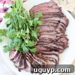 Sliced grilled tri tip steak on plate