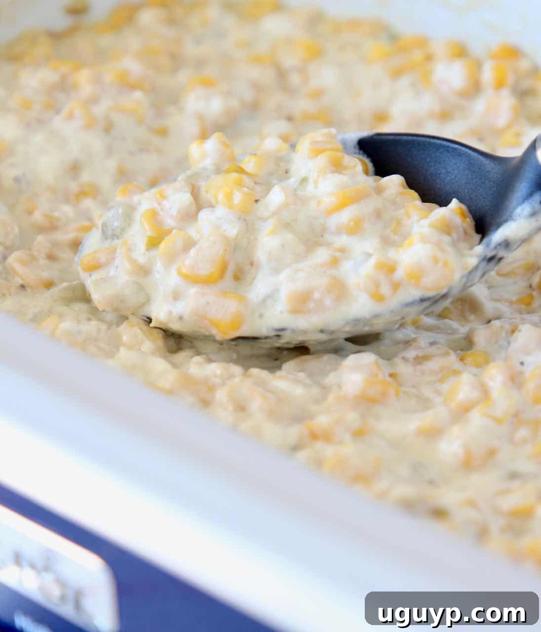 Creamed corn simmering in a slow cooker, ready to be served as a delicious and easy side dish for any meal.
