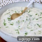 mashed cauliflower in a bowl with a spoon