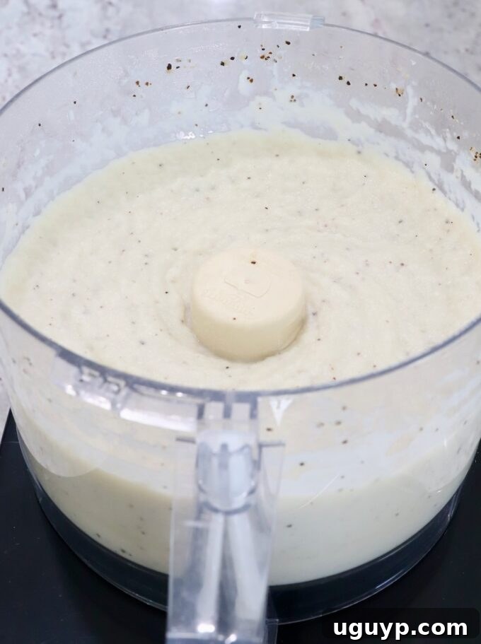 pureed cauliflower in a food processor