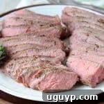 Sliced sous vide tri tip on white plate
