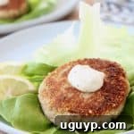 Crispy tuna patties, topped with garlic aioli on a piece of butter lettuce