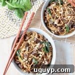 Overhead image of noodles in bowls with chopsticks on the side