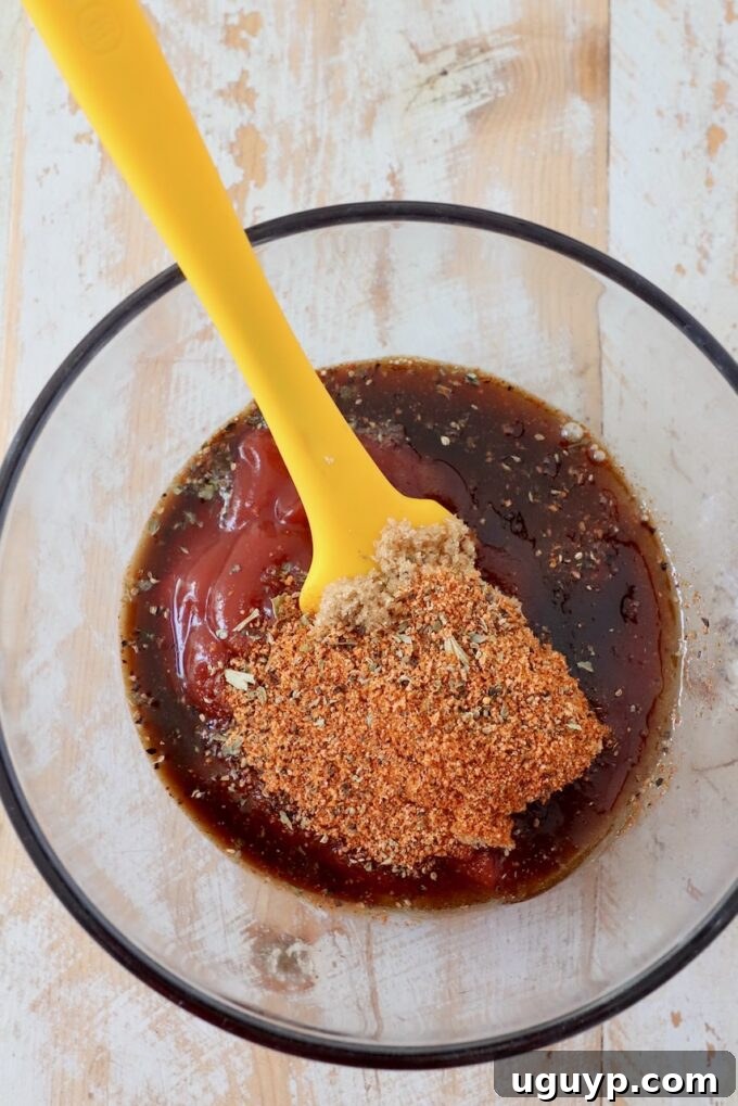 Spices, ketchup, and Worcestershire sauce in a small glass bowl