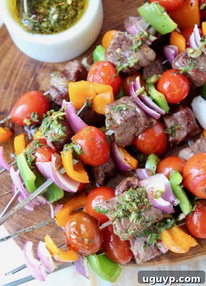 Steak and veggie kabobs stacked on top of each other