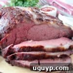 Sliced prime rib on wood cutting board