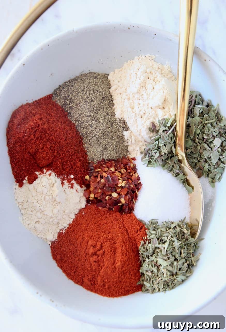 spices in bowl with gold spoon
