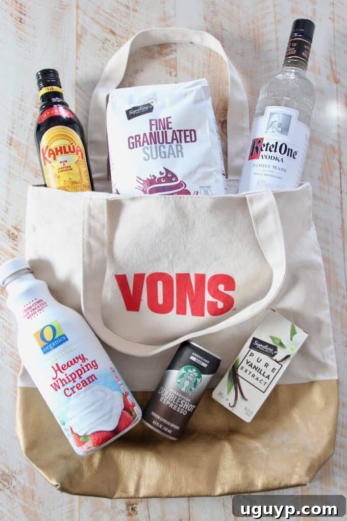 overhead image of espresso martini ingredients sitting on vons shopping bag, including canned espresso, vodka, coffee liqueur, heavy cream, sugar, and vanilla extract